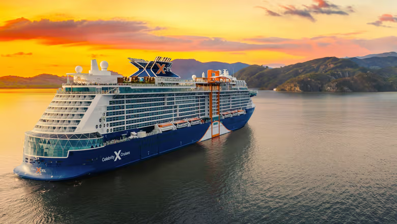 Celebrity cruise ship on calm water at sunset