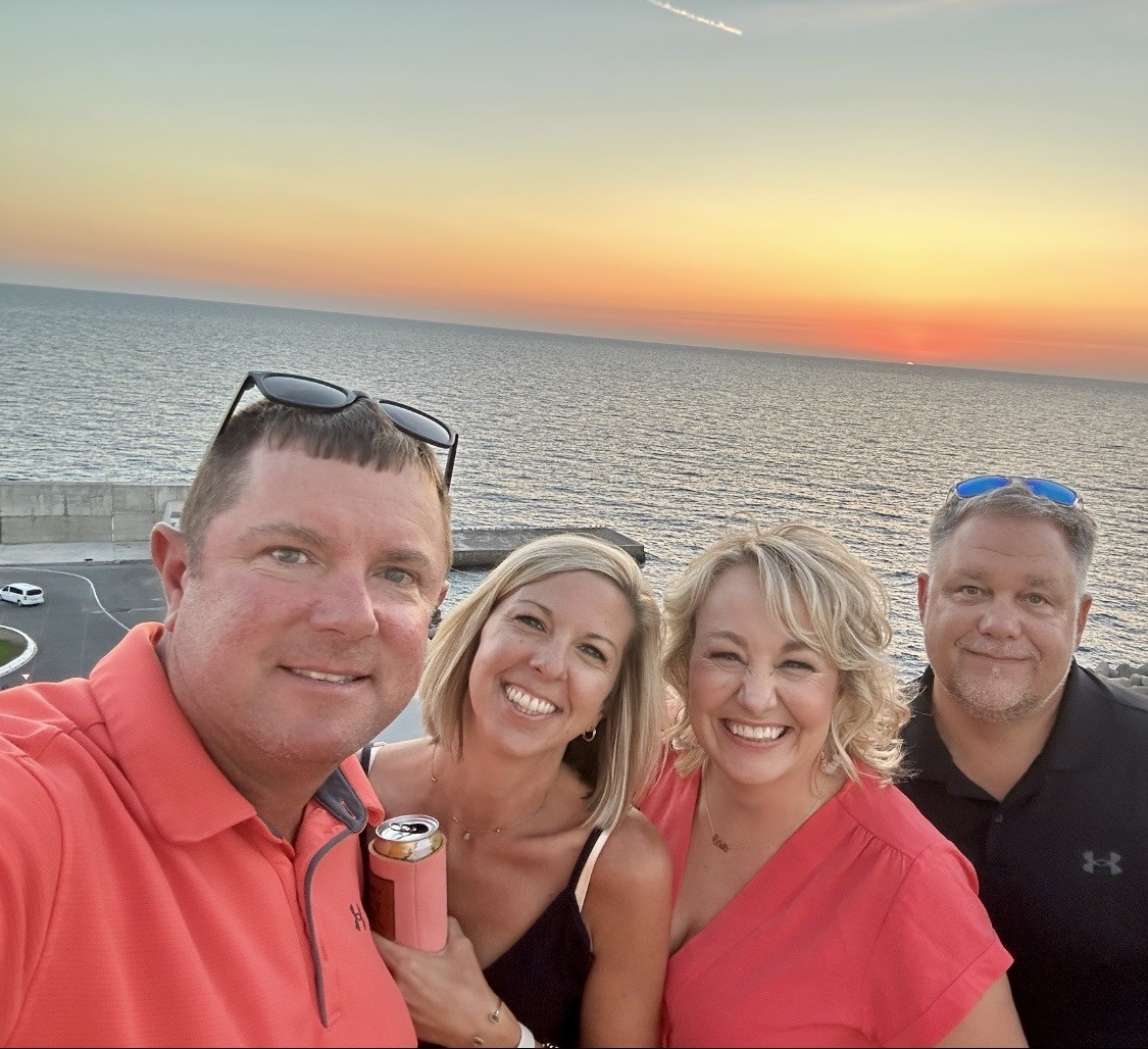 Cindy, Lee, Nicole and Jamie together by the sea at sunset